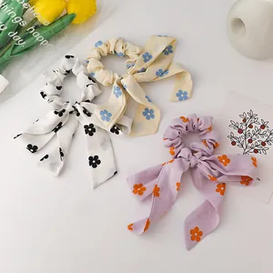 Floral chiffon scrunchie set with bow ribbons in white, yellow, and lavender purple