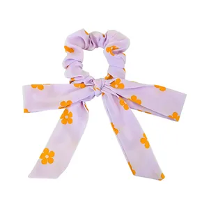 Lavender floral scrunchie with orange daisy print and long bow streamers for women