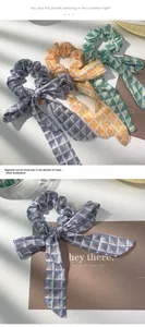 Detail of vintage geometric triangle print scrunchies with long decorative ribbons