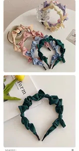 Collection of colorful satin bow headbands with soft pleats and elegant silk texture