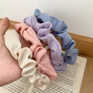 Set of four pleated fabric headbands in beige, pink, purple and blue satin material