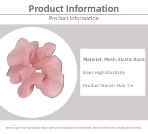 Detailed view of large pink mesh scrunchie featuring grey edge piping and elastic band