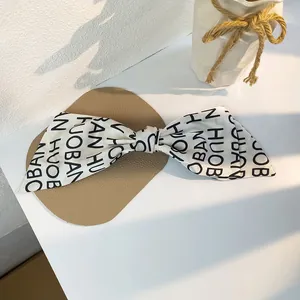 French vintage oversized bow hair clip with black and white letter print for women