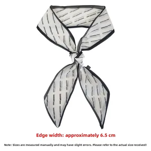 Detail view of printed mesh hair scarf with 6.5cm width and black contrast piping