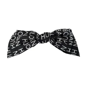 French vintage black satin bow hair clip with white letter print for elegant hair styling