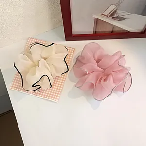 Elegant oversized organza hair scrunchies in cream and pink with stylish black contrast piping