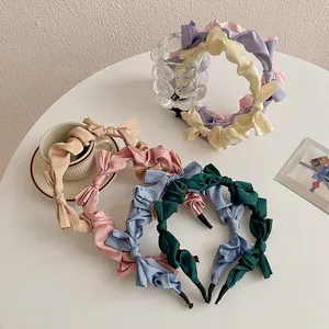 Pleated satin headband set with bow detail in multiple elegant pastel colors