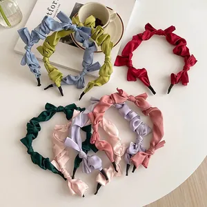 Elegant satin pleated headbands with bow detail in seven various soft vintage colors