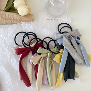 Multi-color silk satin bow scrunchies with long ribbons for elegant hairstyling
