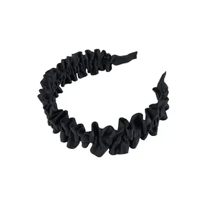 French vintage pleated wide black headband with elegant grosgrain texture on white backdrop