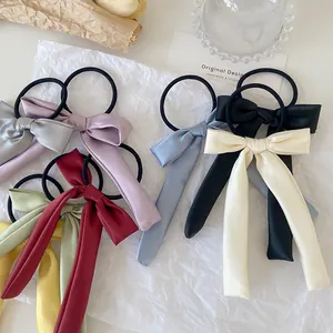 Elegant satin ribbon bow hair scrunchies in various colors for women's hairstyles
