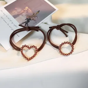 Set of two vintage elastic hair ties with heart and round pearl geometric designs