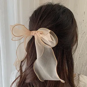 Elegant large champagne organza bow hair tie for women with a romantic Korean aesthetic