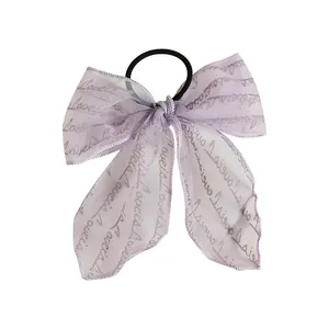 Lavender lace ribbon hair tie with Loveis silver lettering on organza bow