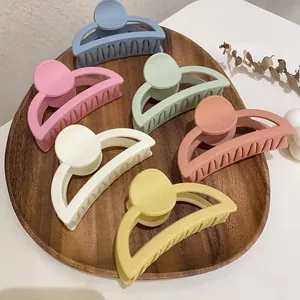 Matte Morandi claw clip set with 6 colors in a wooden tray for elegant hair styling