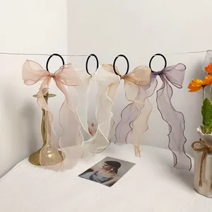 Set of four pastel chiffon bow hair scrunchies with long ribbons hanging elegantly