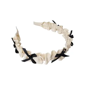 Serre-tête plissé crème élégant avec petits nœuds noirs de style Lolita coréen