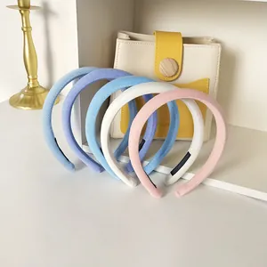 Set of 5 minimalist cream-colored sponge headbands in various soft pastel shades