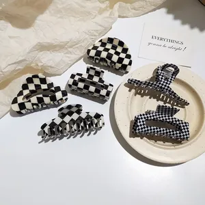 Set of checkered acetate claw clips in black and white styles for summer hair styling