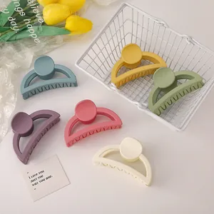 Close-up of 6-piece large matte hair claw clips in assorted pastel Morandi colors