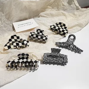 Set of 5 black and white checkerboard acetate hair claws in various geometric shapes