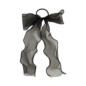 Elegant black organza bow hair tie with long ribbons on a clean white background