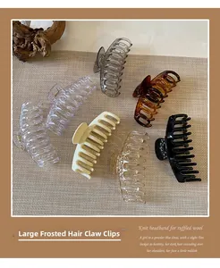 Pinzas para el cabello grandes en varios colores mate y brillantes en tapete tejido
