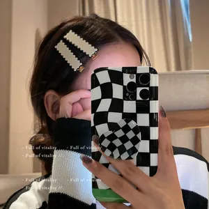 Checkboard pattern phone case with heart stand and wavy cream-colored hair clips