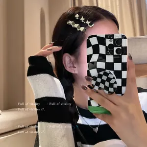 Chic black and white checkerboard hair clips with matching phone case and necklace