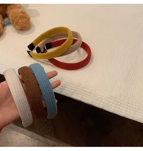 Close-up of knit headbands showing woven texture and protective black non-slip end caps