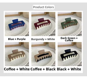 Macro detail of large matte square hair claws in six varied bicolor contrast options