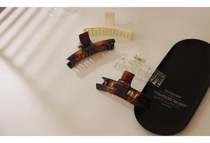Detailed set of acrylic hair claws in tortoiseshell, cream and transparent finishes