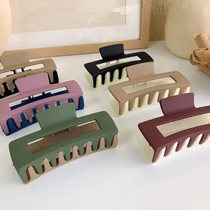 Multi-color array of matte square hair claws with dual-tone hollow rectangular design