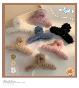 Plush large hair claw clips in seven soft autumn colors shown in a detailed flat lay