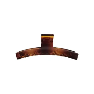 Elegant amber tortoiseshell acrylic hair claw clip with large geometric design for women