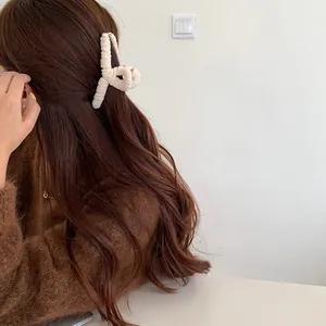 Creamy white plush hair claw clip for women's large twisted faux fur hair accessory