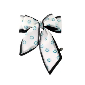White mesh bow hairband with blue smiley face prints and black stitched edges