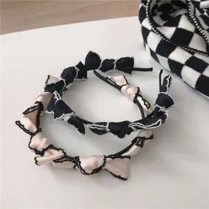 French vintage style bow headbands in black and cream beige with lace trim edge detail