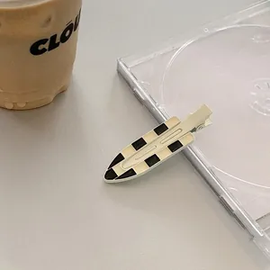 Classic checkered black and white seamless hair clip on transparent CD case