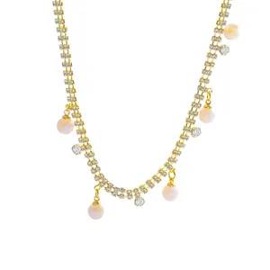 Elegant double-row rhinestone necklace with pearl pendant in a minimalist gold finish