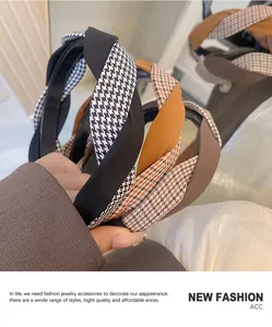 Detail shot of braided houndstooth and solid fabric headbands with premium textures