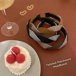 Braided houndstooth headband with twisted wide-brim design in vintage plaid patterns