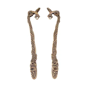 Retro bronze hummingbird and floral vine alloy charms with hanging loops on white background