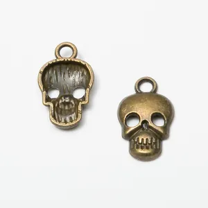 Vintage bronze skull charms in zinc alloy for DIY jewelry making with top hanging loop
