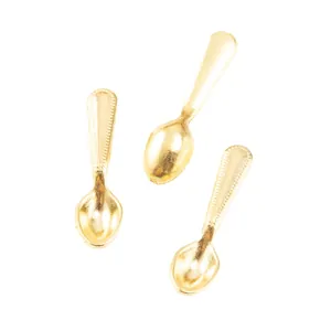 Detail showing three mini golden alloy spoons with beaded texture for dollhouse DIY