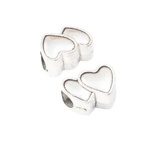 Set de 2 dijes vintage de doble corazón en aleación de zinc con agujeros para pulseras DIY
