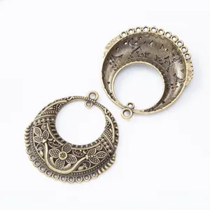 Vintage bronze crescent moon connectors with hollow floral relief for DIY jewelry making