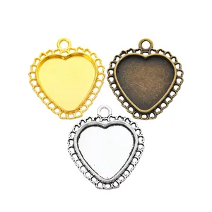 Three heart-shaped zinc alloy bezel pendants in gold, silver and bronze for DIY jewelry