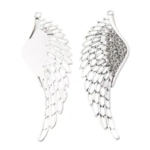 Pair of silver zinc alloy wing pendants for DIY jewelry making with textured details