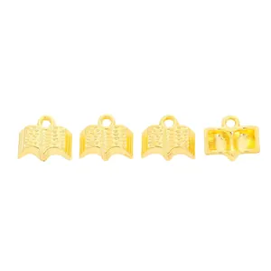 Set of four vintage gold book-shaped alloy charms for DIY jewelry making accessories